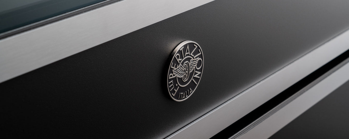 Close-up of black and stainless steel Bertazzoni double oven from Heritage Serie with logo emblem on front panel