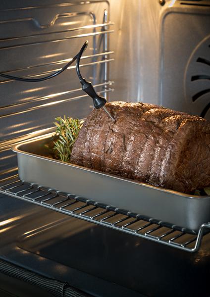 Bertazzoni Professional Serie built-in oven cooking roast with meat thermometer inside large interior cavity
